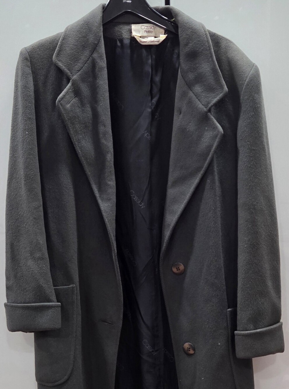 hand-tailored wool coat, featuring a classic overcoat silhouette w/notched lapel